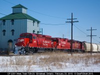 CP GP20C-ECO #2251 leads 2 GP38-2's, #3061 and #3118, on Train T29 as it passes the old, now new looking, mill in Elmstead, Ontario as it speeds along toward Windsor.  T29 was an old favorite of mine as you could always count on it coming out of Windsor in the early morning.  Now that it has been transferred to originate out of London it makes semi-regular runs with overhead cars to Windsor.  As can be seen, with 3 four-axle units for power, there must be a LOT of overhead today.