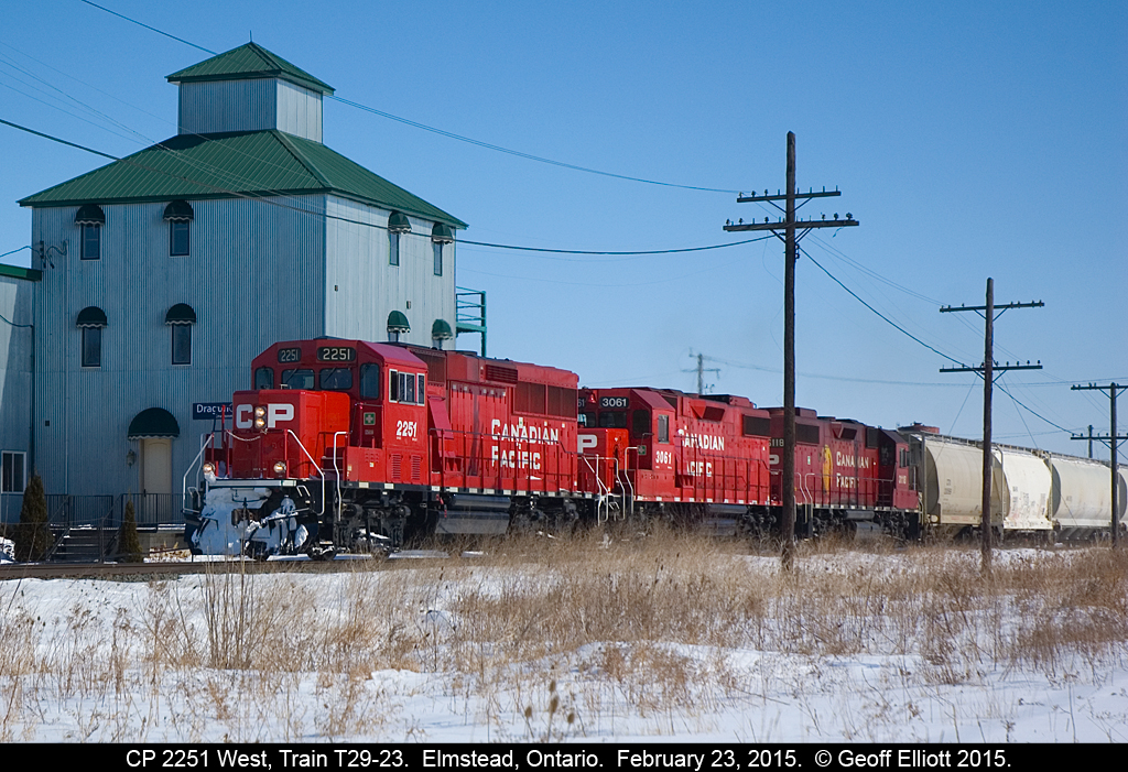 CP GP20C-ECO #2251 leads 2 GP38-2's, #3061 and #3118, on Train T29 as it passes the old, now new looking, mill in Elmstead, Ontario as it speeds along toward Windsor.  T29 was an old favorite of mine as you could always count on it coming out of Windsor in the early morning.  Now that it has been transferred to originate out of London it makes semi-regular runs with overhead cars to Windsor.  As can be seen, with 3 four-axle units for power, there must be a LOT of overhead today.