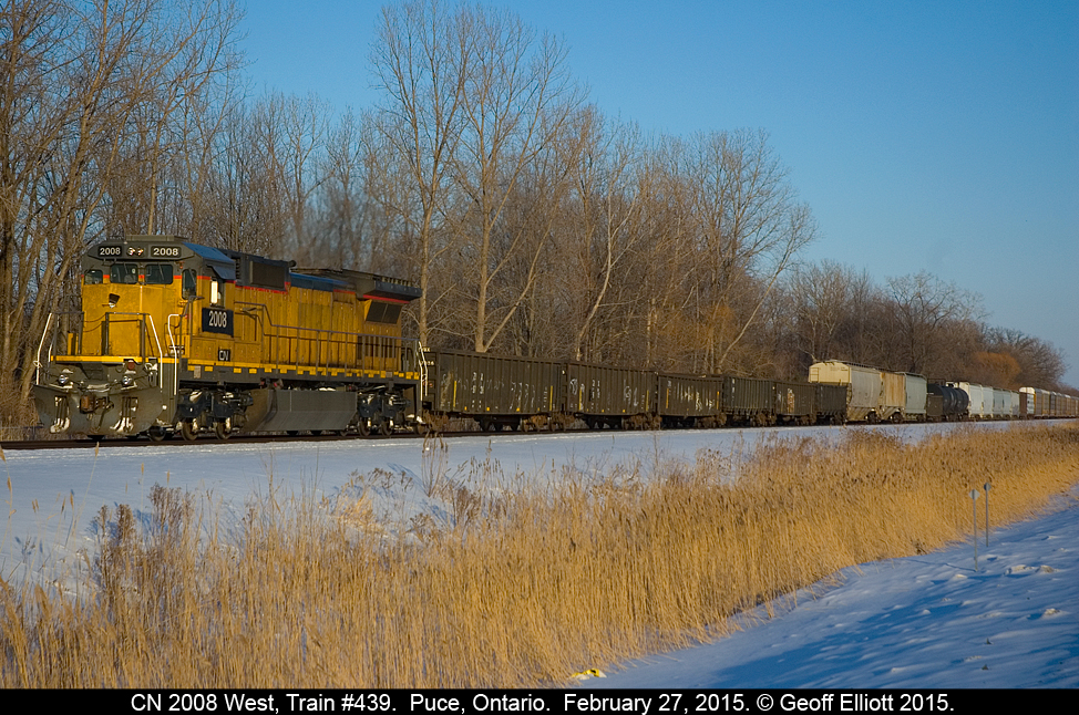 Canadian National C40-8 #2008, a former Union Pacific unit, leads a very long train #439 through Puce, Ontario on a beautiful late Friday afternoon.  This unit is ex-UP 9035 and was built as Chicago & North Western 8504 in July of 1989.  Looking at this unit just goes to prove to me that old Used Car Salesmen don't die, they go move on to selling old, beat up locomotives!!!  Hard to believe that CN, being power short, went out and bought 25 year old locomotives to supplement it's roster.