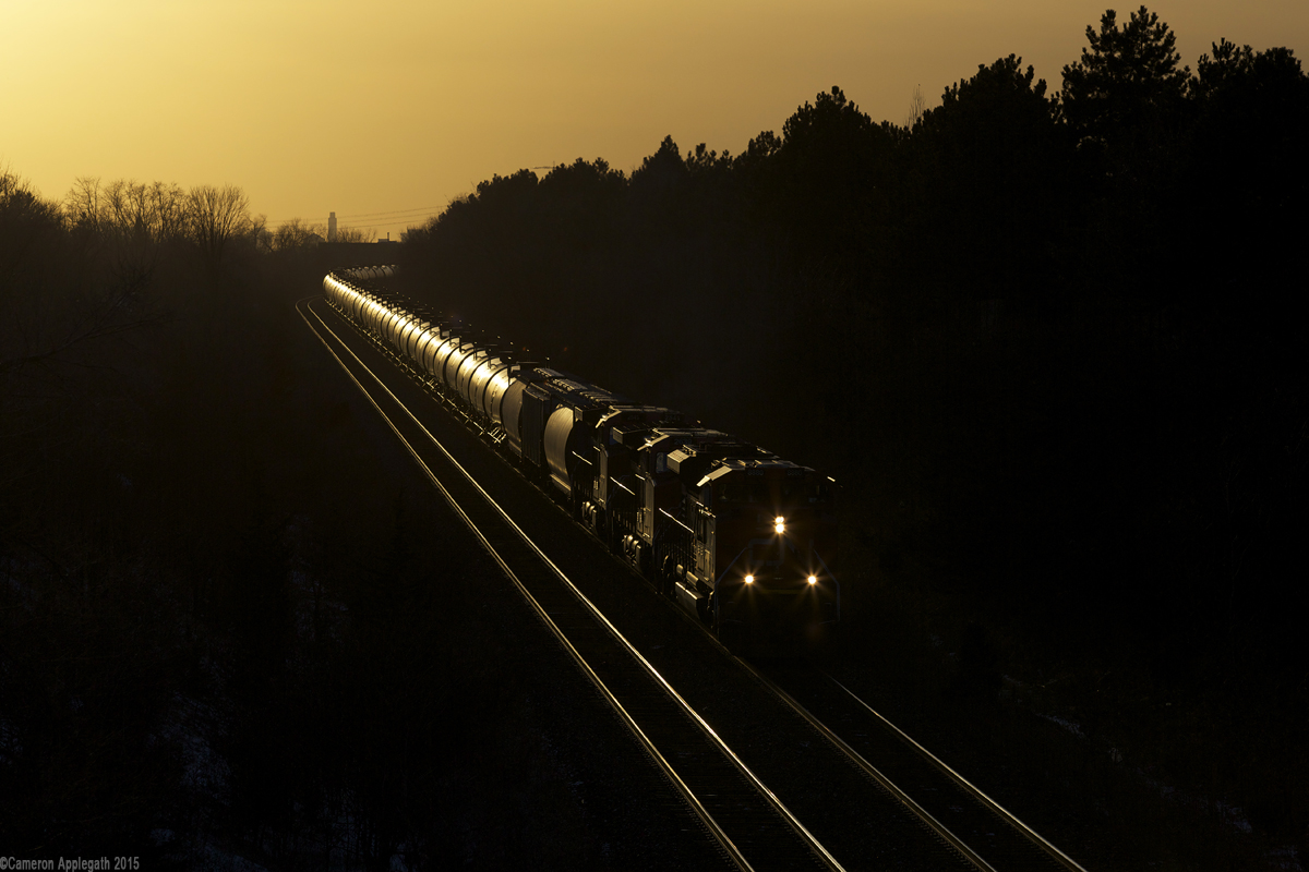 CN M308 heads east into the evening, two miles out of Mac Yard.