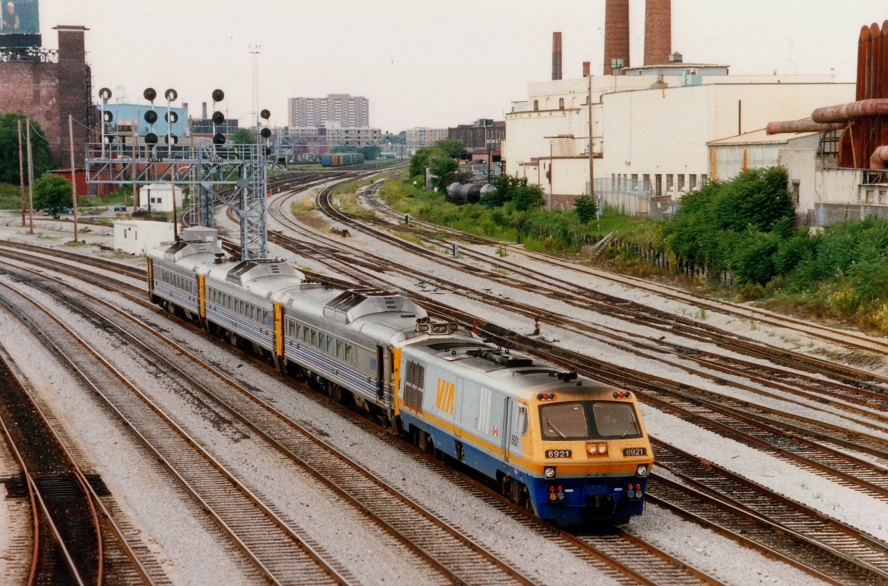 As seen from Bathurst St bridge, VIA 6921 transfers a BuddCar set from the GO/VIA maintenance facility over at Mimico to Union Station.  Track heading north in photo is CN Weston Sub and the CP MacTier Sub.