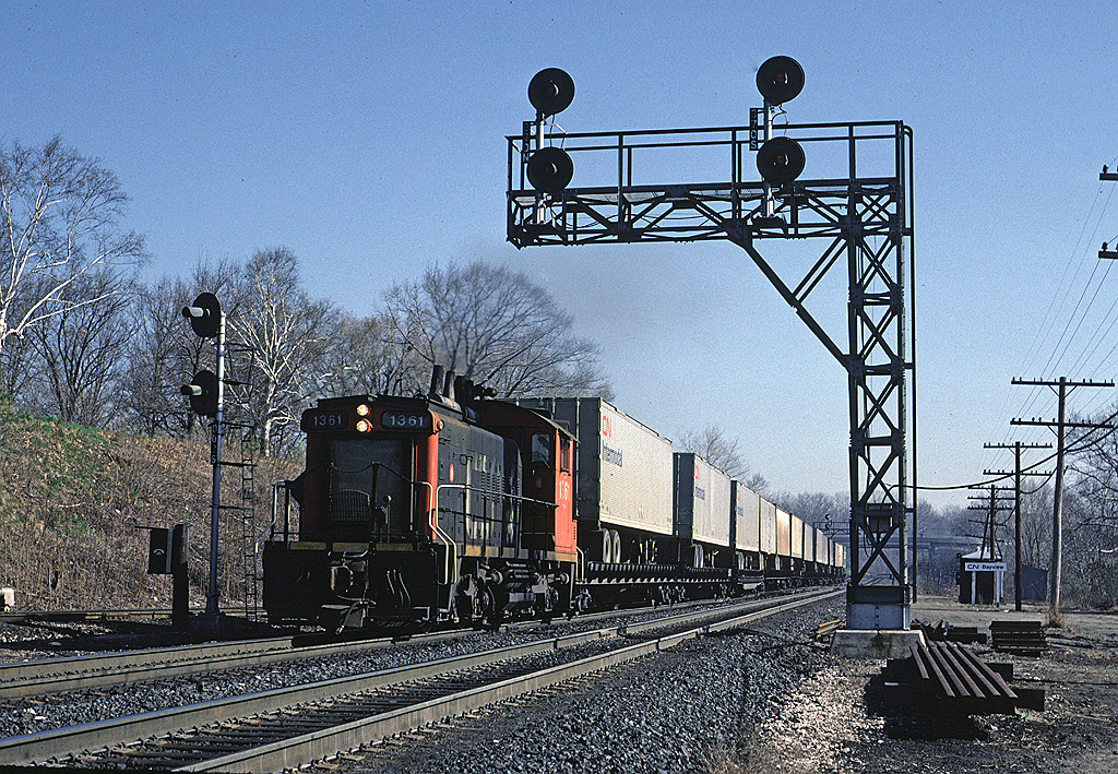 CN SW1200RS 1361 is heading back into Hamilton after coming out to Bayview to turn some piggyback trailers on the wye.