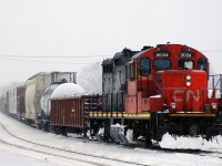 CN 7081 provides a shove out of town to a rather delayed M38531 04