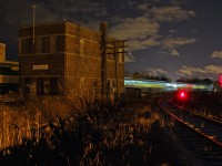 The orginal wooden tower was replaced in the 1950's by a modern brick tower on the opposite side of the mainline. 59 years later and still standing an ONR passenger train rolls by and will drop off a GO bilevel at the west end of Mimico, passing the long ago boarded-up Canpa tower that once controlled movements off CP's Canpa Sub in the foreground.