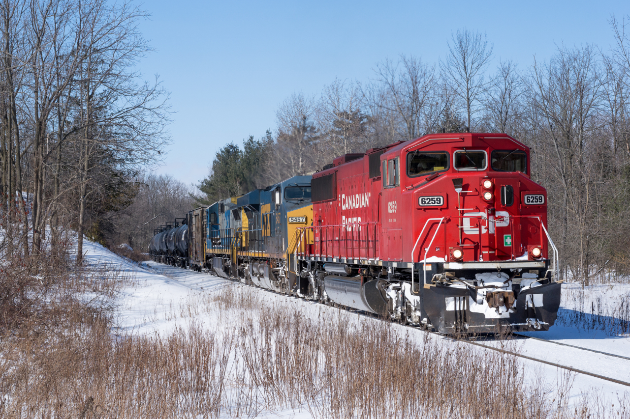 Apple Crisp! A brawny EMD SD60M (ex-SOO 6059) guides Canadian Pacific train # 640 down the Hamilton Subdivision, just south of the 'Guelph Junction' mileboard on a crisp February afternoon.