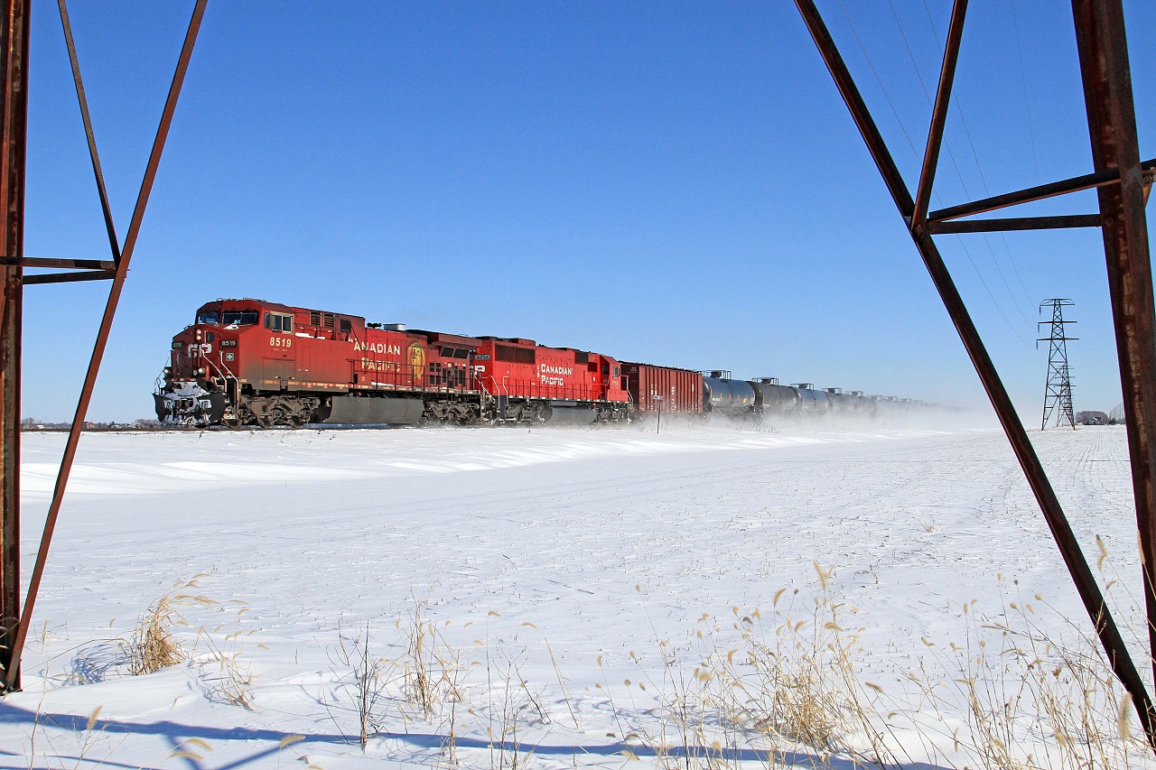 CP 8519, with helper CP 6256, are in charge of U.S. bound train 551 at mile 88 on the CP's Windsor Sub.