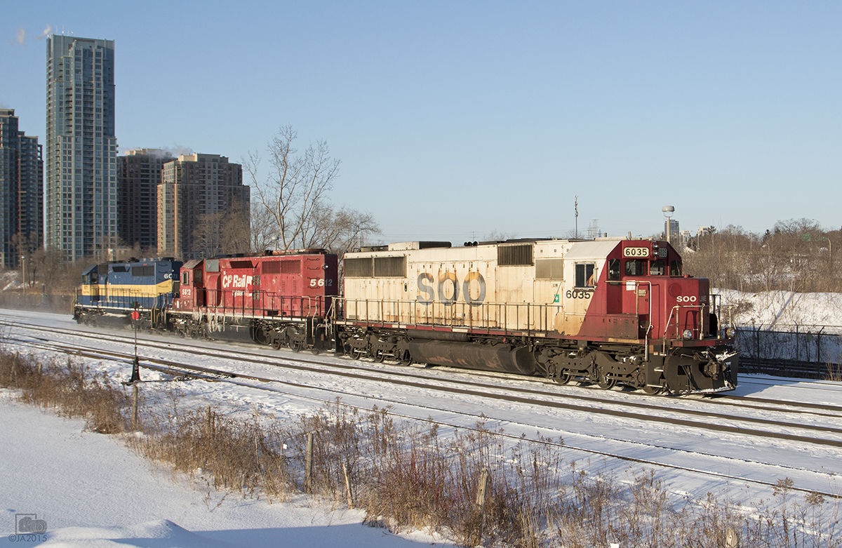 CP 242 runs light power to Toronto yard, with SOO 6035, CP 5612, DME 6071.