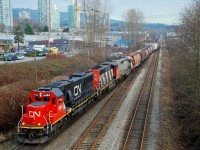 CN 5483 is leading the way through Willingdon Jct as this load of grain is taking the Thornton Tunnel line to North Vancouver. The trailing unit appears to be an unusual SD40-3.