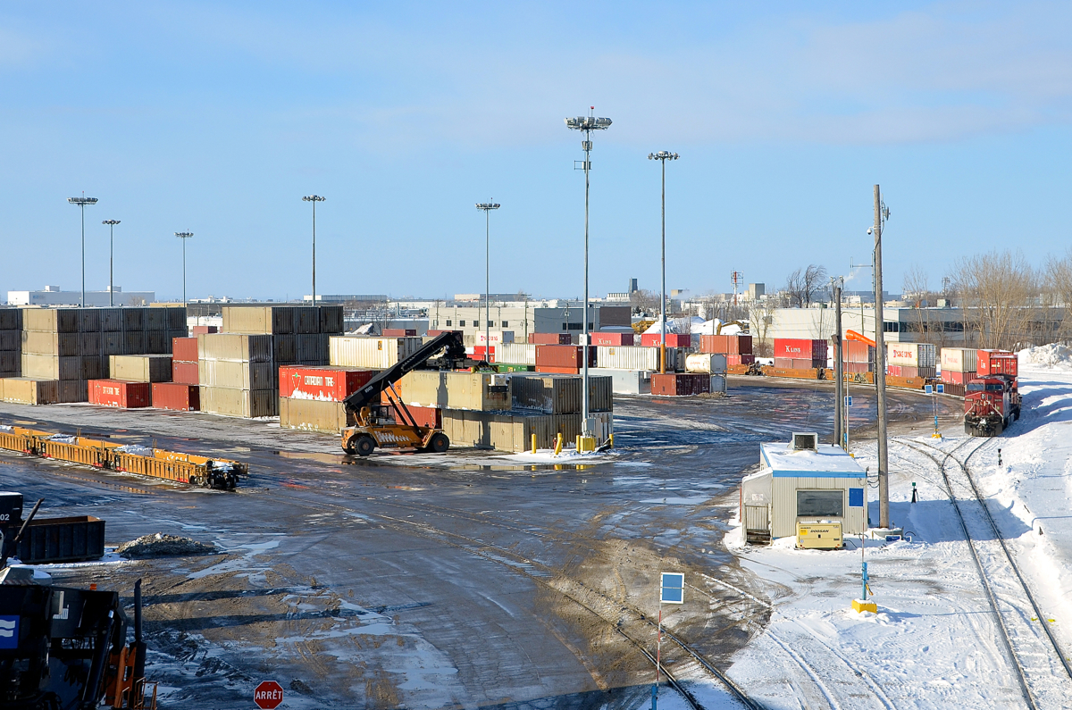 A mostly still yard during a short-lived strike. CP 9659 is idle and there is not much movement in CP's Lachine intermodal yard this past Sunday, when CP engineman were on strike.