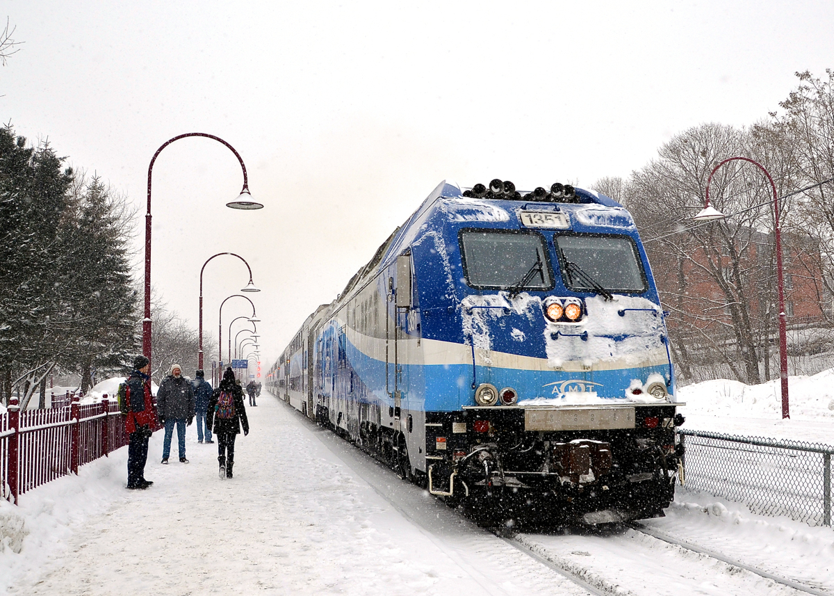A snowy commute. AMT 112 with dual mode engine AMT 1351 leading is about to stop at Montreal West during a snowy morning rush hour.