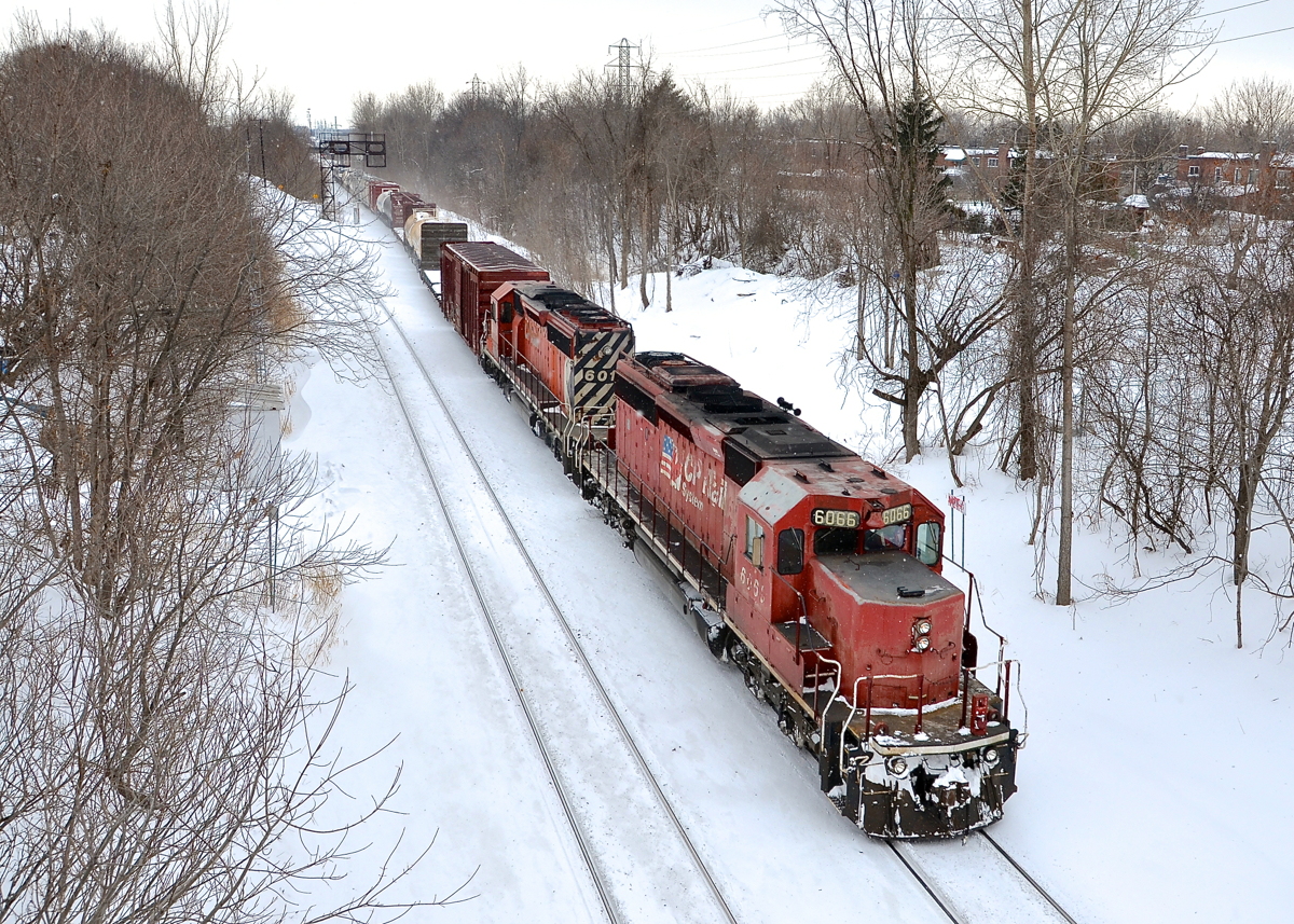 A very short CP 253 from Binghamton, NY has two SD40-2's as power (CP 6066 & CP 6018) as it heads through Montreal West towards nearby St-Luc Yard.