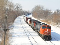 A rather lengthy CN X324 is eastbound with CN 5777 and CN 2122.
