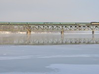 <b>Over the Richelieu river.</b> VIA 22 from Montreal is heading for Quebec City with VIA 6427 leading as it passes over the Richelieu river. 