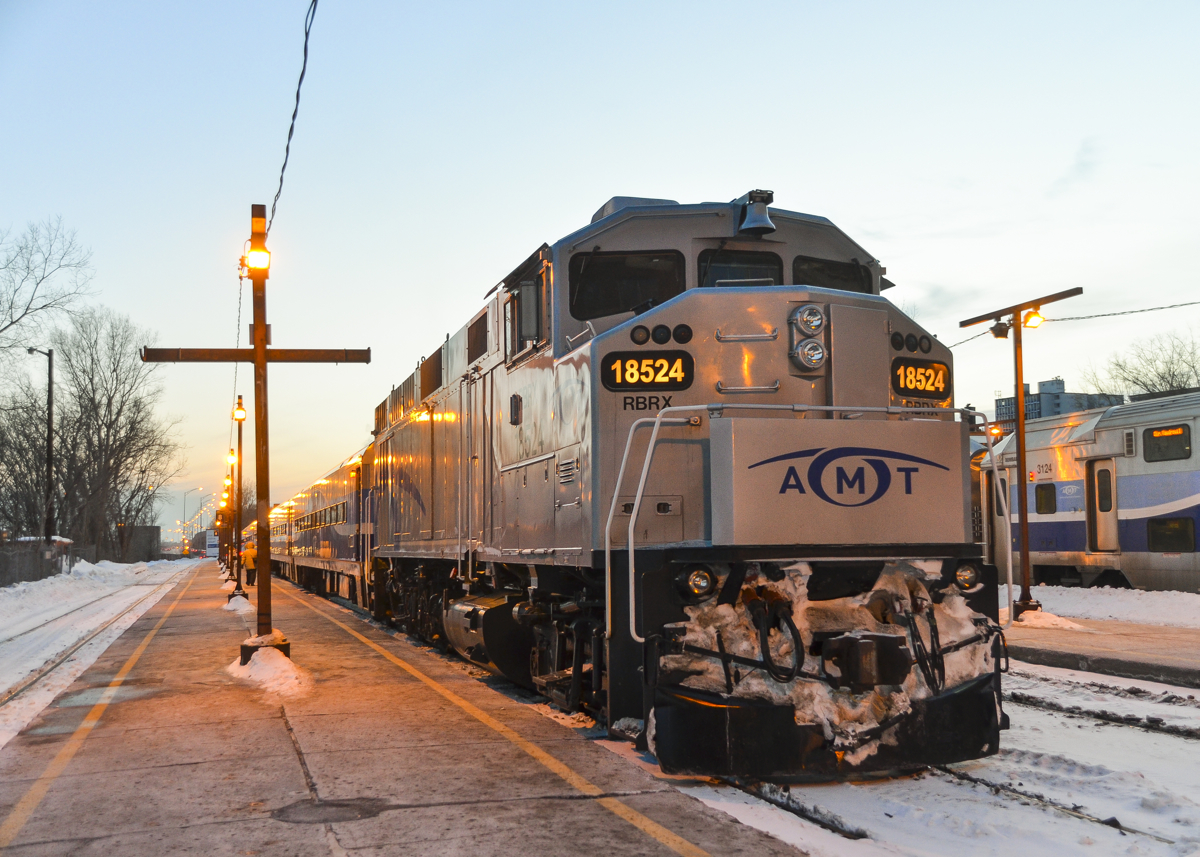 A five digit engine, back in service. RBRX 18524 is an ex-GO Transit F59PH which unusually has a five digit engine #. It was out of AMT service for well over a year, but has been back in service a few weeks now. Here, just after sunset, it is about to push AMT 77 out of downtown Montreal and towards Candiac.