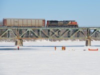 CN 310 is crossing the Richelieu River with SD70M-2's at the head end and mid-train (CN 8830 & CN 8888). Even after setting off 76 cars at Southwark Yard, it still had 416 axles. Of note is the local fire department doing some training exercises on the river. 