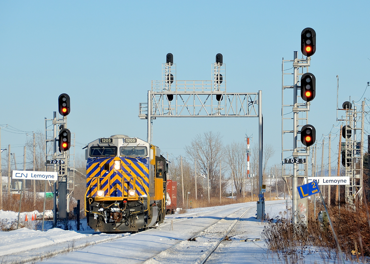 Approaching St-Lambert Station. A short CN 527 is westbound through St-Lambert with CREX 1205 & NS 2549 as it approaches St-Lambert Station.