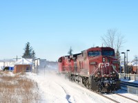 A late CP 132 comes around the curve at Sainte-Anne-de-Bellevue at the western tip of the island of Montreal with CP 9765 & CP 8565.