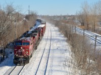 CP 119 has a three pack of CP GE's (CP 8628, CP 8567 & CP 8940) leading a long train as it heads west through Beaconsfield. It would soon come to a stop with a hotbox detector announcing a hot wheel had been detected.