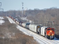 CN 368 has 640 axles total as it passes through Beaconsfield with shiny CN 8920 leading and another SD70M-2 mid-train. In the distance at right is an AMT train on the parallel CP Vaudreuil Sub.
