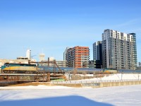 VIA 6431 is at the head end of the combined VIA 601/603 train as it passes the Peel Basin south of downtown Montreal. Until Hervey Junction in northern Quebec, VIA 601 to Jonquière and VIA 603 to Senneterre run as a combined train. Each train has an F40, a stainless steel coach and a stainless steel baggage car. The second engine is VIA 6438.