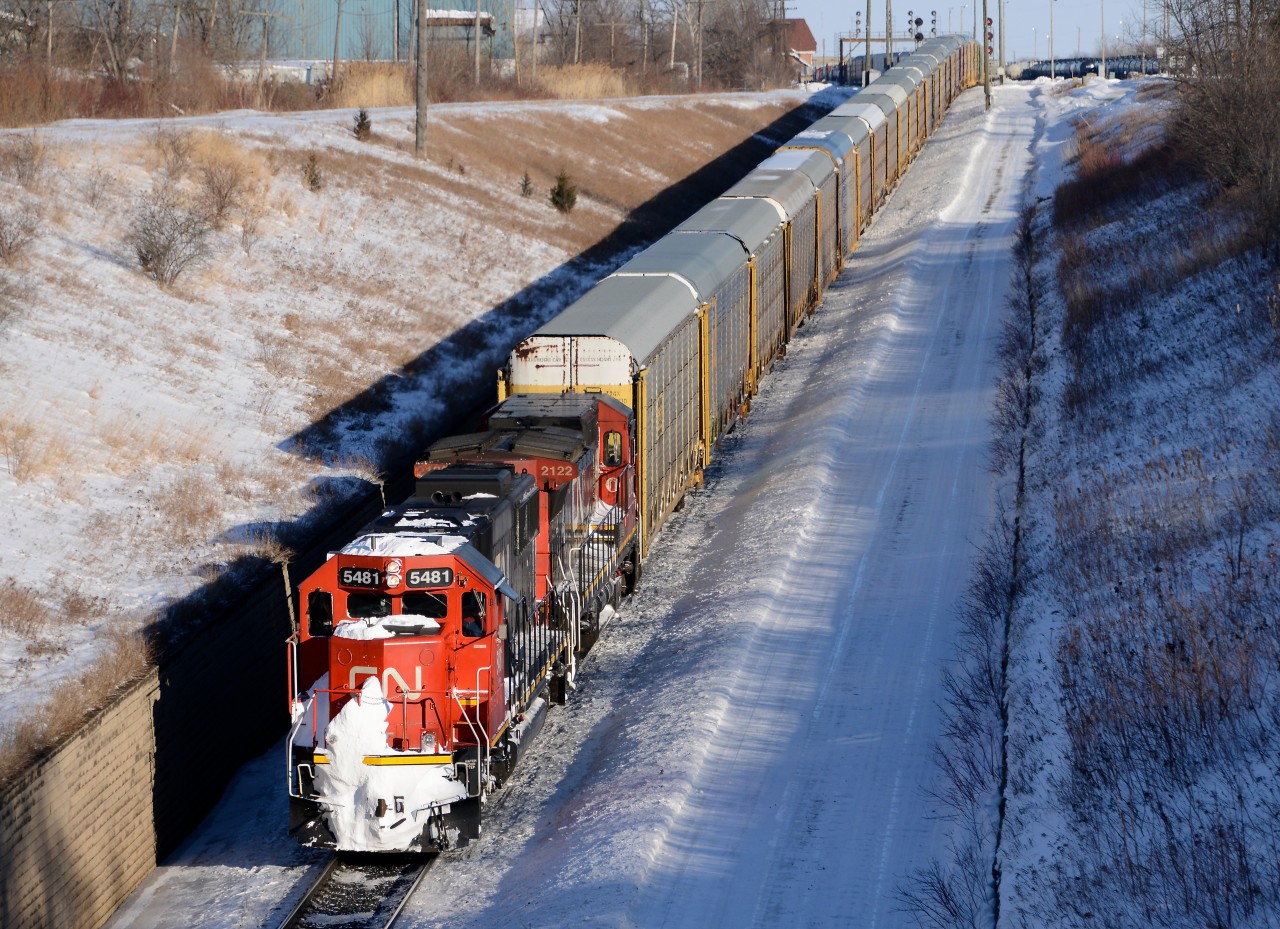 Train 393 heads into the St. Clair River Tunnel with CN 5481 and CN 2122.