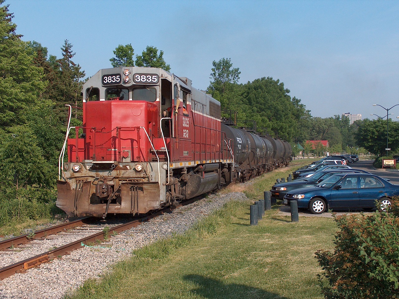 GEXR 3835 leads this evening's wayfreight up to Elmira. Here we see it at the north end of Waterloo Park approaching Seagram Drive, past the parking. I often parked here when I studied at UW to avoid paying for parking. And I was a park patron! I was enjoying the view of this beautiful late spring evening!