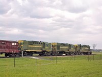 Circa 1959, the late Del Rosamond captured this trio of MLW RS18's under a threatening sky. 
