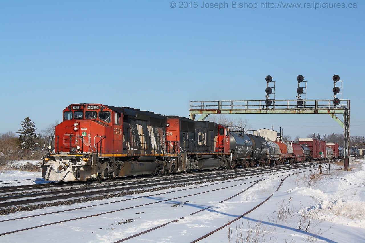 A veteran SD40-2W leads CN train M33131-10 under the signal bridge at Paris Junction with a lengthy train.  CN 5296 and CN 5639 were the power on 331 on this day.  They crew was having issues with the 5296 and spent quite a bit of time talking with the diesel doc to sort out issues.
