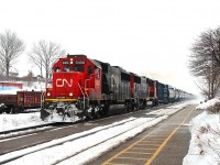 A very short 331 of only tank cars and a centrebeam as a barrier car speeds west through Woodstock on the north track. Locos in charge CN5400 and 5615.