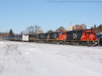 CN 384 cruises through Brantford with CN 5468 leading CN 2648 and BCOL 4653 on a sunny February morning.