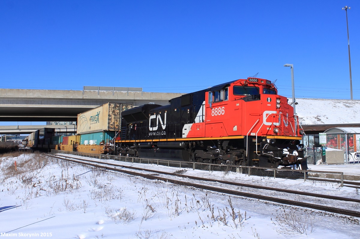 Its -25, feeling like -40 with the wind. Its cold. And Canadian National intermodal freight train Q10251 from British Columbia, Canada rolls by with a fresh EMCC SD70M-2 on point. About midway, was an Illinois Central GE DASH 9-44CW in CN paint locomotive helping.