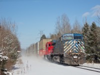 With a rather odd combination of power, CP 118 kicks up some winter dust as it glides through Ypres with CEFX 1032 and CP 2276. Having a clear to stop signal indication up ahead, it will pull into the siding at Baxter to wait for what I believe is 247. Since the rebuilds of the GP9u's into practically new GP20C-ECO's, CP has been fearless in using them on manifests and other long distance freights. It would not surprise me if the power remained intact from Edmonton. This may serve as a surprise, but this section is double track, and the only thing that gives that away is the switch stand about a 10th of a mile north, and the space between the mainline track and sign in the middle ground. Ypres was once a regularly used passing siding with signals, however it was decommissioned when the more advanced Baxter siding was built just south of it. It is now an infrequently used storage track, which last received use about three weeks ago.