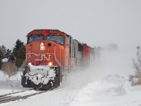 All trains were a later than usual this morning. Even Via 97, which managed to stay on time for a while, got nailed by the hotbox detector at mile 18.9 for carrying a good chunk of ice. Here, CN 422 passes Jordan after noon with three locomotives, CN 5603, CN 5553 and CN 5287. Don't believe me? It's okay, I didn't think you would. The nice layer of powder from a lake effect has not subsided since 331 passed earlier. Thankfully, it got a bit warmer. The feel temperature still hovered around -30 however. Thankfully, the actual temperature never got that cold, otherwise all trains would have to restrict to 30mph. The RTC neglected to put any trains on the south track all morning, however, I believe CN 330 used it later that night. 331 and 422 were both very short, and 422's length of 60 cars was especially surprising. Perhaps the long weekend had something to do with it.