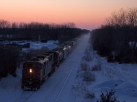 This would not be the first time I managed to find CN 330 making its way through Stoney Creek while I'm heading home on the QEW. The majority of times, I could not be bothered to get a picture, however zebra stripes do help. After remaining silent for probably at east 8 hours, 330 lifts some powder off the tracks as it heads east for Port Robinson. Rather short as usual, only 25 cars are in tow. While difficult to notice, the signal on the north (closest) track in the distance at the Jordan interlocking is green over red. 330 just cleared the single track about a minute before, and Via 98/Amtrak 63 (Maple Leaf) will be passing under this bridge in just a few minutes, making for a timely appearance of 330. While this may make the CN Grimsby Sub look busy, they come in bunches. After 98 passes, powder will be able to settle likely for at least another 12 hours.