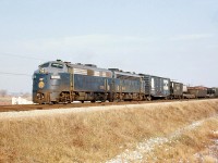 A nice back-to-back A-A set of matching F-units is always a treat: Norfolk and Western F7A's 3726 and 3666 pass by on the north main of CN's Chatham Sub at Thamesville Ontario, with a nice mixture of manifest freight in tow.