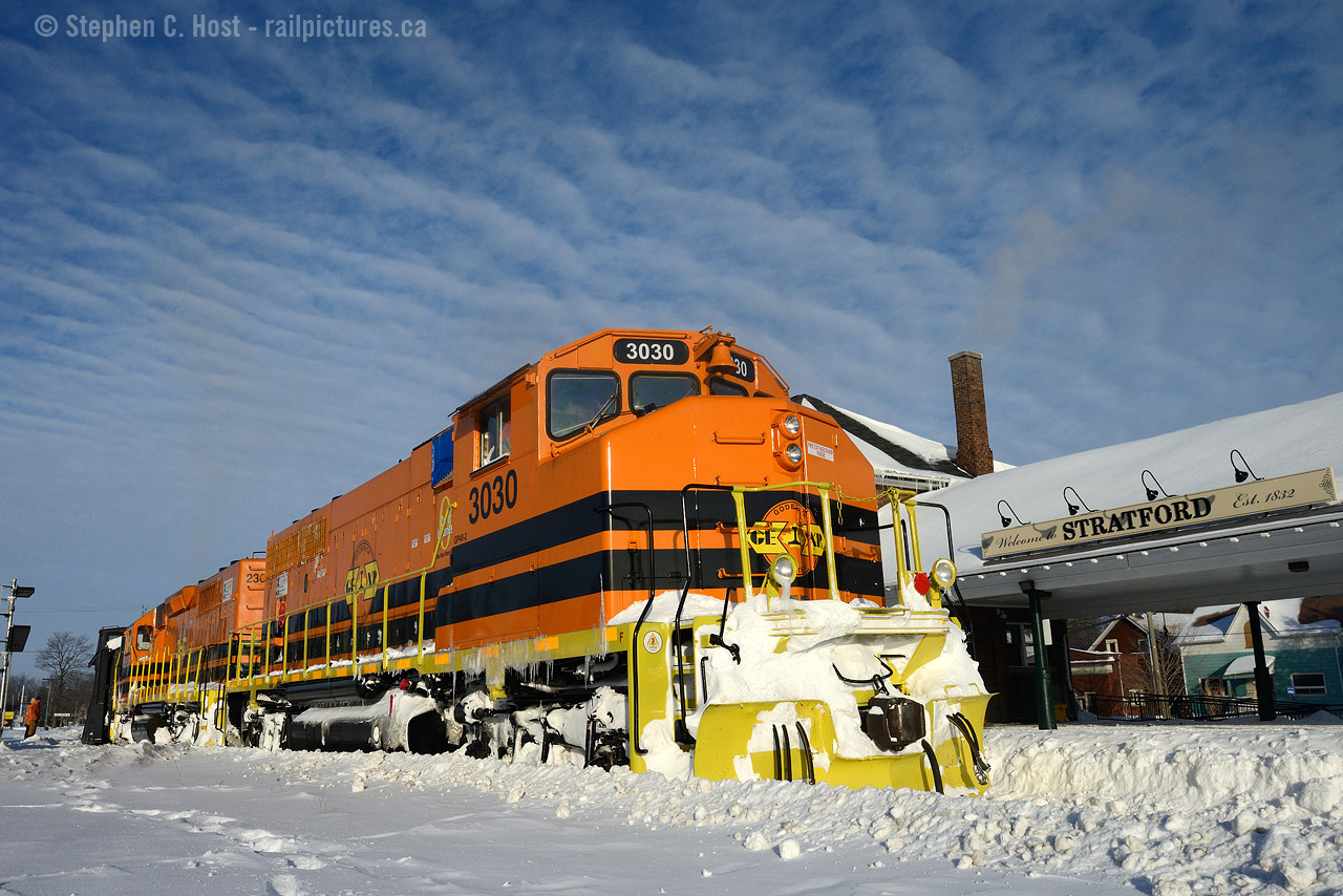 A teaser, I know..I had planned a trip to visit family in Sarnia on the weekend, but the 402 was basically closed most of the weekend. Extreme winds and blowing snow usually lead to one thing on our Plow stabling railroads.. right? So with no plans on Monday morning I headed to Stratford to see if anything was running, and I was gifted with this sight in front of the station. The time is 0830 and 581-16 will plow instead of run freight to Goderich, for the first time with two GW orange units. 
Where's the action? You'll just have to stay tuned - later this week I'll post an action shot. In the meantime, I'll turn over the show to those that photographed OSR today - seeing that they called the plow for Tuesday the 17th 2015. Quite honestly, had Family Day not occurred - Monday would have been a two plow day in SW Ontario. A thought: There are not that many locations left in North America, if any, that have such a possibility of two plows in a day, are there? Discuss below.