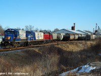 Remember these days? RLK 1401, presently a superstar over at Ontario Southland Railway toils in relative obscurity on GEXR back in 2006. 581 heading west in a late day move to Goderich, switching customers all along the line. 