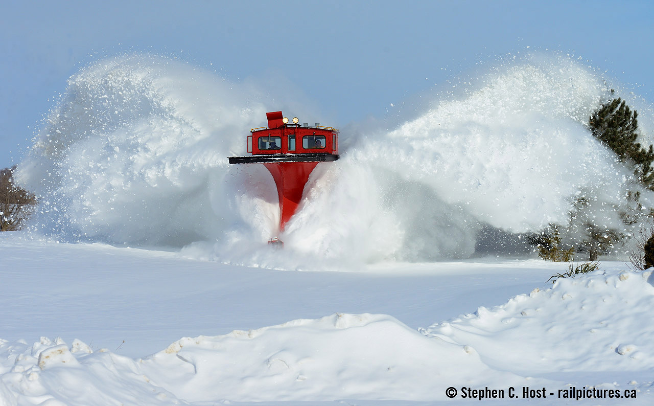 You'll have to take my word for it that this train is powered by two FP9A's. After dropping the flanger blades a couple more inches, Foreman Jack Hyde and Brad Jolliffe are in the plow, looking closely at a few photographers (including yours truly) about to get dumped on, surely with smiles on their faces. OSR flanged nearly all of their track today with CPR 401005 but I was only witness to part of the journey.