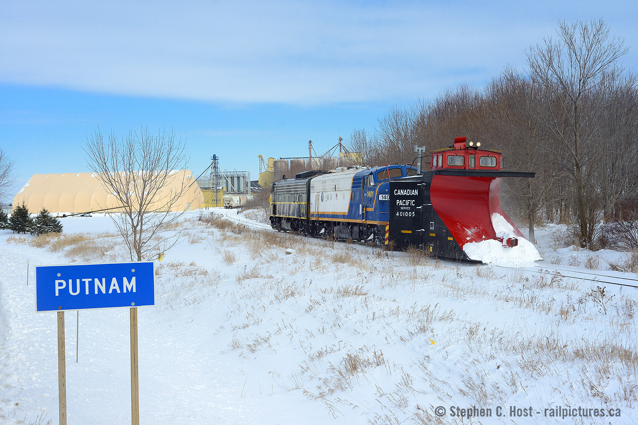 Two F's power the first plow extra of OSR's 2015 winter season, passing through the small town of Putnam. Up ahead, heavy drifting near Gladstone, where views of the entire train are much harder to come by.