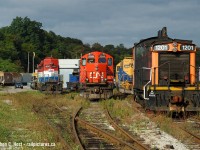 Now historic - this scene has been obliterated in the last year. I believe all of these units in the photo (but one) have been saved - 1201 - where did this end up? GEXR 3856 was sent to sister railroad OVR, 4057 is still on the SOR. The former freight shed at left, the shops behind the power, and all this track was basically torn up in favour of new alignments for the James St. North GO station project.Anyone with updates on location of some of this power - please add to comments. It was around this time SOR/RA was busy scrapping everything they could get their hands on , thanks to new owners Fortress Investment Group, scumbucket hedge fund that squeezes blood from rocks. More on this later..<br><br>What unit did not survive? look closely and you'll see what appears to be a blue slug. It's RLK 4205 - cut down to nearly the frame and in process of being scrapped. This engine survived at best in parts only. 