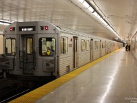 Late evening finds a set of Toronto Transit Commission H6 subway cars making a stop at Keele Subway Station to drop a few passengers off. Car 5903 trails, one of the group of 100+ H6 cars built in Thunder Bay by UTDC/Can Car Rail in the 80's (5810-5935). A bit more troublesome than the rest, an option for more new Toronto Rockets was exercised to replace the entire H6 fleet, and the last train retired in June 2014.
<br><br>
<i><b>More H6's?</b></i><br>
5911 at Woodbine Station: <a href=http://www.railpictures.ca/?attachment_id=13651><b>http://www.railpictures.ca/?attachment_id=13651</b></a><br>
An H6 interior (pre-refurb): <a href=http://www.railpictures.ca/?attachment_id=15491><b>http://www.railpictures.ca/?attachment_id=15491</b></a><br>
5886 departing Yonge in a flash: <a href=http://www.railpictures.ca/?attachment_id=15090><b>http://www.railpictures.ca/?attachment_id=15090</b></a><br>
H6 train at Castle Frank: <a href=http://www.railpictures.ca/?attachment_id=4666><b>http://www.railpictures.ca/?attachment_id=4666</b></a><br>
Zooming out of Sherbourne: <a href=http://www.railpictures.ca/?attachment_id=15492><b>http://www.railpictures.ca/?attachment_id=15492</b></a><br>
Crossovers at Keele: <a href=http://www.railpictures.ca/?attachment_id=18072><b>http://www.railpictures.ca/?attachment_id=1807</b></a>