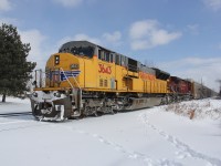 CP 235 slowly makes its way west with UP 3643 and CP 9604. He was about to meet CP 640 which was waiting on the main track at Orrs Lake siding. In front of 235 was a solo CP GE which was headed to Wolverton and was tacked on to CP 240 later in the day. Time was 12:12.