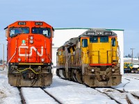 CN SD75I 5713 and CN C40-8s 2015-2019 idle outside of the "locomotive shop" (if you will) in Grande Prairie, AB in mid February. 2015 and 2019 still wear their previous owners colours and may do so for a while if they're kept up here in yard/local service.