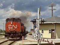 CN Train 561 starts to pull out of Hagersville ON on it's way to Nanticoke under a threatening sky. Classic MLW power doing what it does best.