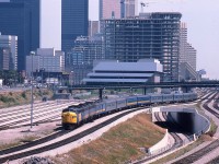 Northbound Canadian leaving Union approximately 1230; power VIA 6506, 6621 and 6636. Looking at this scene from almost 30 years ago with all the construction buzz, it is hard to believe that even today buildings are going up by the score. There always seems to be room for still another condo tower in the ever-changing skyline.