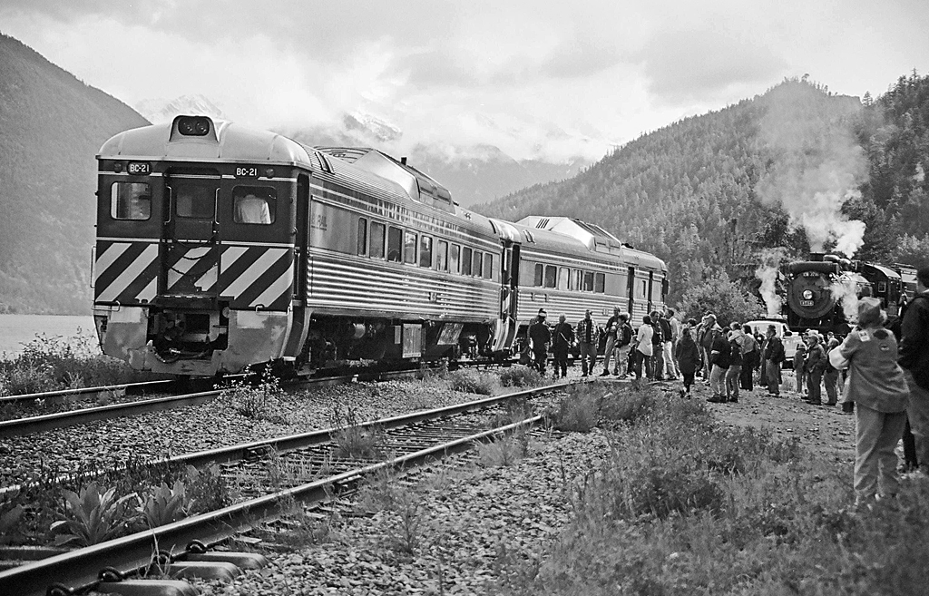 Heres another of the Trains Unlimited 3716 charter. Our train has been put into the pocket track at Marne, located along Anderson Lake for a meet with the southbound passenger train. BC Rail was unique for its use of RDCs and it was a neat opportunity getting them meeting the steam. Both now of an era gone, but not forgotten.