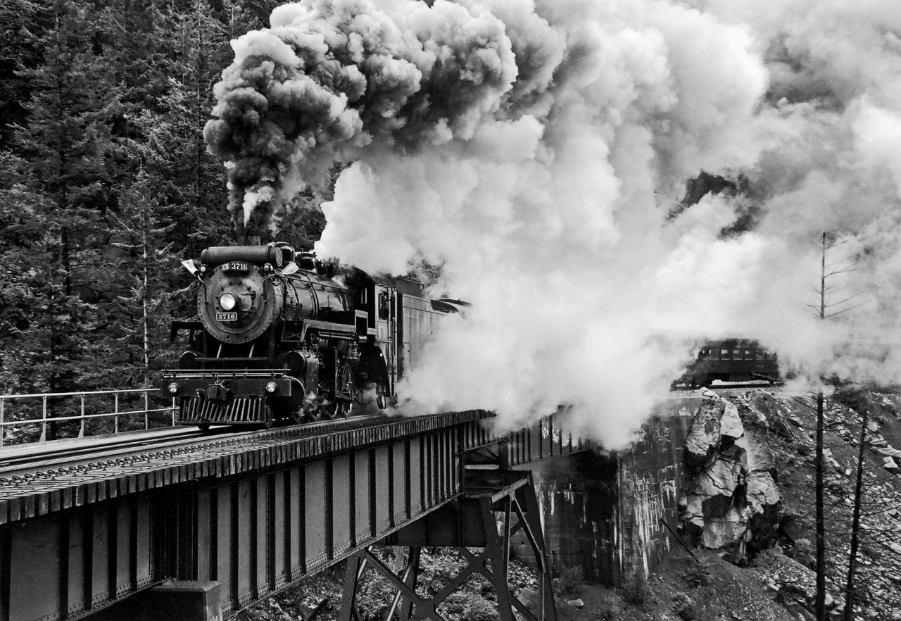 During the weekend of May 27, 28, 29, 2000 Trains Unlimited Tours chartered the BCR "Port Coquitlam" 3716 and 4 cars from BC Rail for a trip from North Vancouver to Kelly Lake, BC. The trip consisted of photo run bys in many of the scenic locations along the Squamish and Lillooet subs. This scene, taken crossing the Cheakamus River Bridge, was one of those examples.