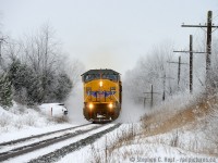 Dancing through the snow, CP 234 sports a foreign leader as they make track speed for Toronto. Unbeknownst to the crew, the WILD detector at 42.6 is about to go off, cutting short the track speed journey and forcing a set-off at Guelph Junction. Poor crew, not a good day for a set-off 60 cars back... But a great day for a photo (If you like Winter, that is). Brrrrrrrrrrrr. 