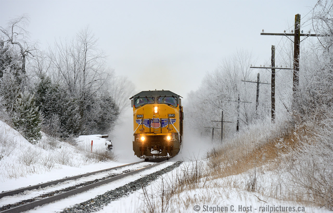 Dancing through the snow, CP 235 sports a foreign leader as they make track speed for Toronto. Unbeknownst to the crew, the WILD detector at 42.6 is about to go off, cutting short the track speed journey and forcing a set-off at Guelph Junction. Poor crew, not a good day for a set-off 60 cars back... But a great day for a photo (If you like Winter, that is). Brrrrrrrrrrrr.