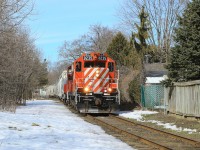 8235 and 1210 lead their train back through Guelph after servicing customers in the northwest of the city.